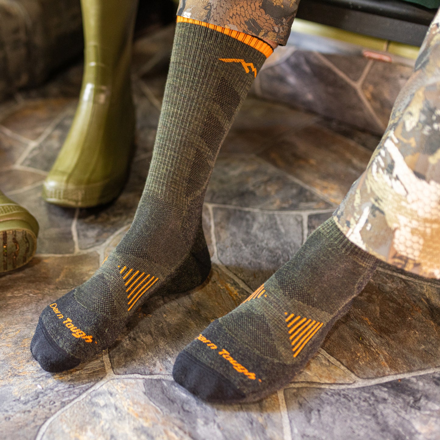 Darn Tough lightweight hunting socks in forest on model