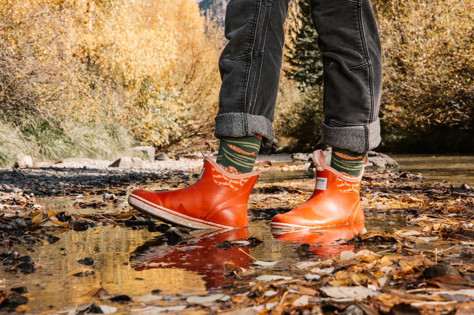 Darn Tough 6122 with model walking through puddle