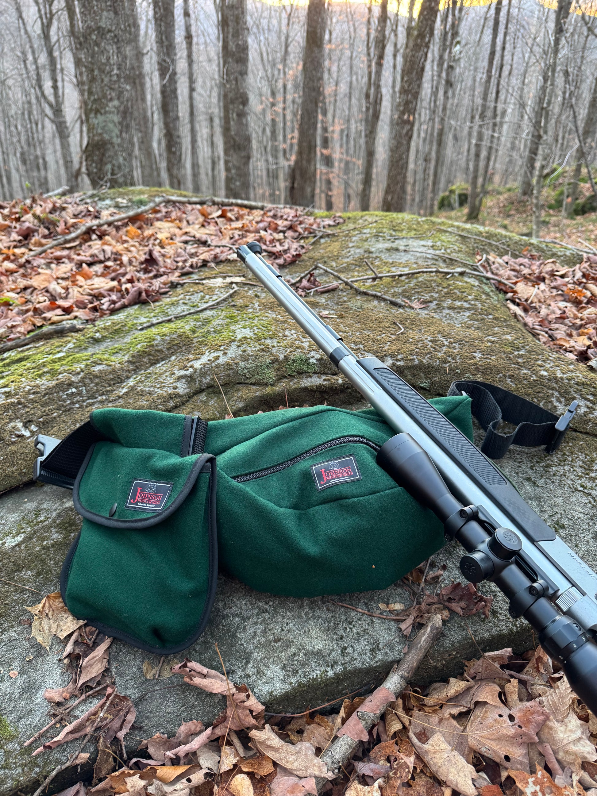 Fanny pack and black powder pouch in the woods